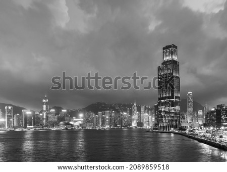 Skyline and harbor of Hong Kong city at dusk