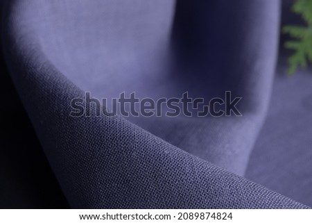 Linen fabric, lavender background. Soft linen lavender fabric texture. Textured fabric background. Macro with shallow dof. Trendy color 2022 - Very Peri