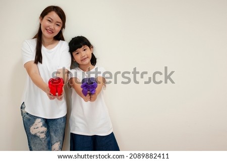 Mother and daughter with birthday presents. Happy mothers day! Beautiful girl and her mother with gift box at home.