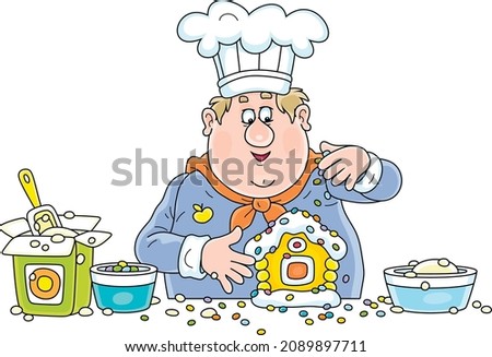 Funny cook confectioner in a chef hat standing at his kitchen work table and decorating a fancy Christmas gingerbread in a form of a sweet toy house, vector cartoon illustration isolated on white