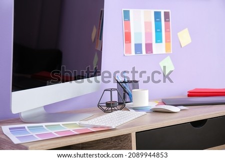 Comfortable workplace of graphic designer in office
