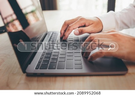 Data search technology search engine optimization with blank search bar, man hands working with laptop computer Searching  internet data information.