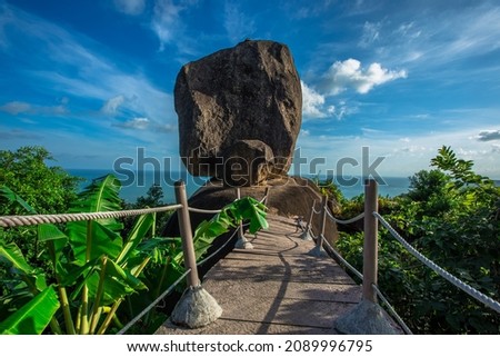 Background of evening natural light on high mountains overlooking the sea, coconut palms,hillside villas and large rocks (overlap stone) on Koh Samui,Surat Thani Province of Thailand Royalty-Free Stock Photo #2089996795