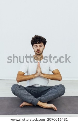 man doing exercises yoga asana fitness gymnastics