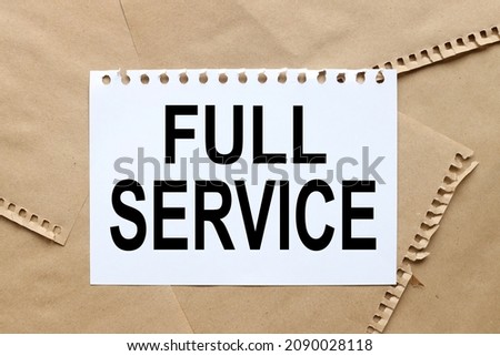 FULL SERVICE. text on white sheet of paper on craft torn paper
