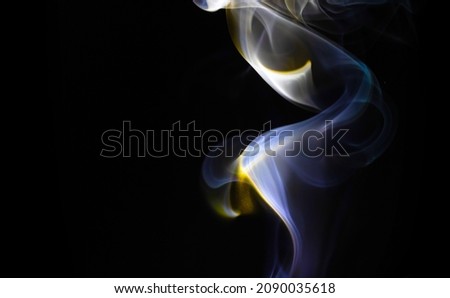 Blue smoke flow on a black background. Colored fog texture, abstract backdrop