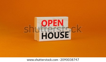 Time to open house symbol. Concept words Open house on wooden blocks on a beautiful orange background. Business and time to open house concept. Copy space.