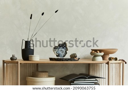 Creative composition of stylish living room interior. Candlectick, trays and personal accessories. Copy space. Template.
