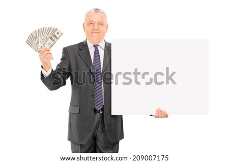 Mature businessman holding money and blank banner isolated on white background