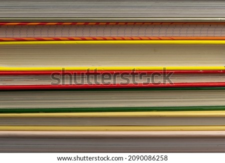 Book stack texture background. Old magazine edges close up, journal pile, detailed book edge, vintage comicbook pack, waste paper side view