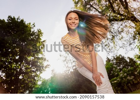 Photo portrait woman spending free time in green city park smiling overjoyed happy with sunny warm weather Royalty-Free Stock Photo #2090157538