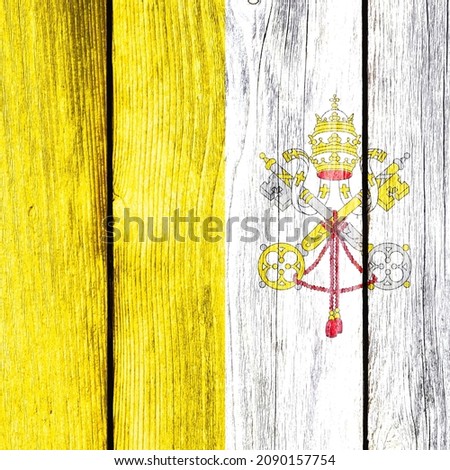Grunge pattern of Vatican City (See of Rome) flag isolated on weathered wooden fence board. Abstract Holy See religion politics history culture concept background