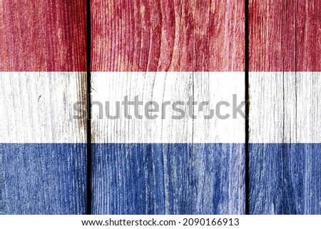 Grunge Netherlands pattern of national flag isolated on weathered wooden fence board. Abstract Dutch politics history culture concept background