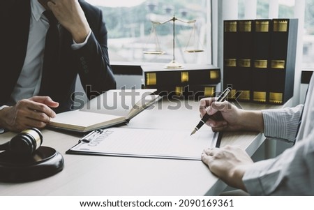 Businessman hand sign contract after lawyer providing legal consult dispute.