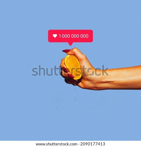 Contemporray art collage of female hand squeezing lemon and having one million like icon isolated over blue background. Concept of social media, influence, popularity, modern lifestyle and ad