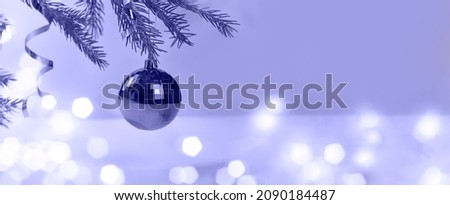 Christmas. Christmas background. Christmas. Festive Christmas card. Banner. very peri. Festive ball on fir branch. Copy space