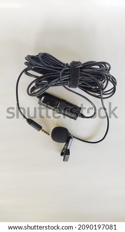 Condenser lavalier tie clip microphone, tool isolated on white background