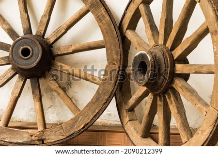 A close view of old cart wheel.