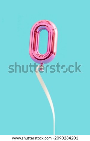 Pink Balloon O or number 0 levitate on air on blue background. Minimal unique Isometric creative idea of letters. Spring, summer or valentine concept.