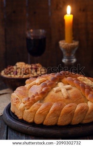 Serbian slava cake with wheat and candle.  Slavski kolač. Decorative bread for traditional celebration. Royalty-Free Stock Photo #2090302732