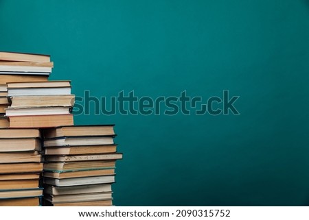 educational books for studying in the university library on a green background