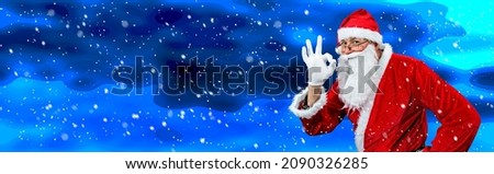 Postcard with Santa Claus showing the OK sign on a snowy background. Emotion concept.