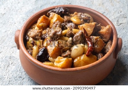 Traditional delicious Turkish foods; Quince and plum lamb stew, lamb tandoori (Turkish name; Ayvali - erikli kuzu guvec - kuzu tandir Royalty-Free Stock Photo #2090390497