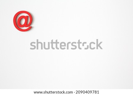 Red wooden symbol "at" on white background and copy space for social media educational concept