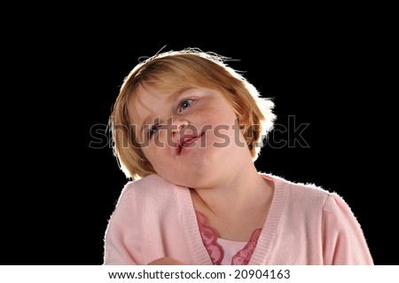 Special needs girl isolated against a black background