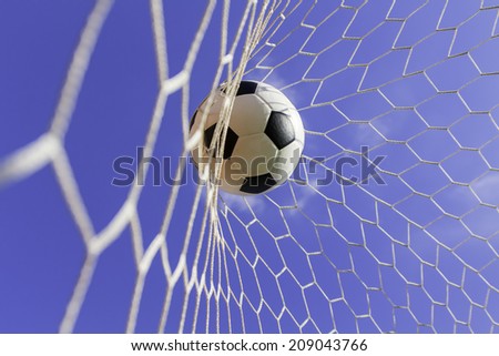 soccer ball in goal on the field