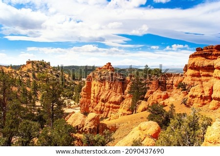 Red-brown canyons and outliers are composed of soft sedimentary rocks. Red Canyon Arches trail in Losee Canyon. Landscapes of the west of the USA. 