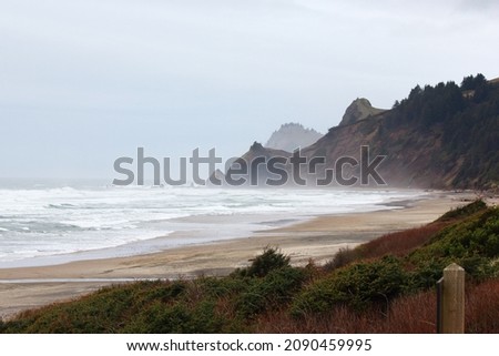 Scenic view of Oregon Coast at Lincoln City. Picture taken on a foggy morning at the beach created the dramatic view