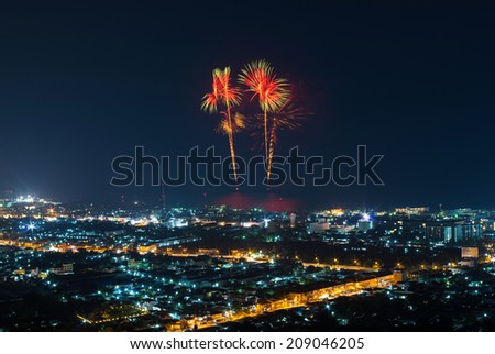 Beautiful muliticolor Fireworks from the boat on the sea with hua hin cityscape, thailand