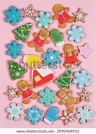 Christmas cookies set. Isolated ginger cookies with decoration on colored background. Sweet and delicious holiday gift. Ginger Man, Christmas tree, snowflakes, toys and more