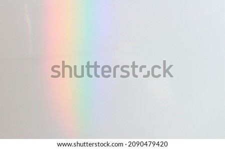 The rainbow at home. A closeup picture of rainbow on the white porcelain surface of a toilet in an afternoon. Looks good for background.