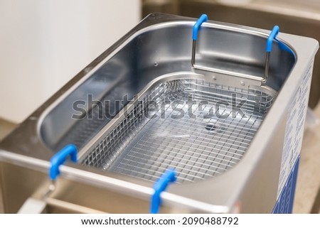 Ultrasonic bath for cleansing objects and jewelry. Royalty-Free Stock Photo #2090488792