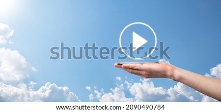 Businessman pressing, hold play button sign to start or initiate projects.Video Play Presentation. Idea for business, technology.media player button. Play icon.Go. Royalty-Free Stock Photo #2090490784