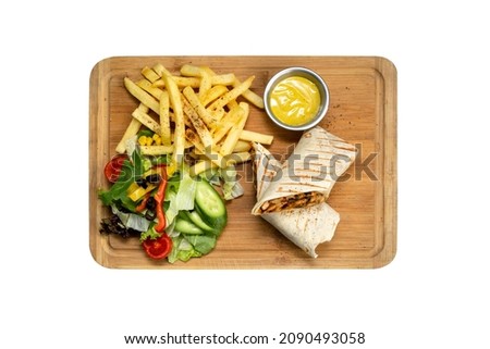Chicken wrap - tortilla bread, served with fries on isolated white background