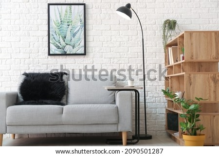 Interior of modern living room with lamp and sofa