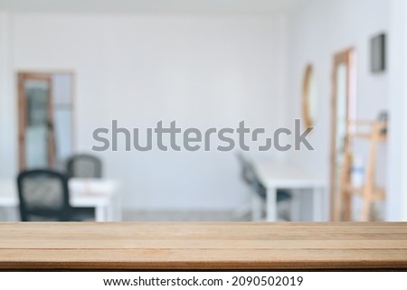 Empty wooden table with blurred background of cafe. For your product display montage.