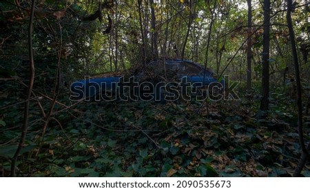 old blue car abandoned in the yard of large abandoned house . High quality photo