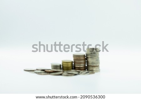 Blurred photo of stacking coins. Stack of coins.