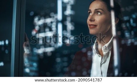 Office: Successful Businesswoman in Stylish Suit Working, Looking in Wonder at Night City. Stylish Female CEO Working Late and Hard to Create e-Commerce Online Shopping Experience Sustainable and Safe Royalty-Free Stock Photo #2090541787