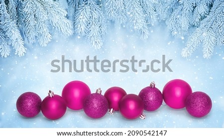 Christmas Winter background with decor of magenta baubles. Beautiful Christmas wallpaper. Template with copy space for design flyer, greeting card, banner, billboard for Christmas and New Year holiday