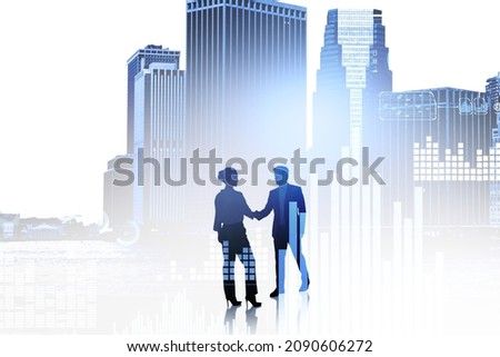 Two partners shake hands full length, silhouette. Double exposure of financial bar chart and icons, toned image, New York city view. Concept of financial agreement and deal