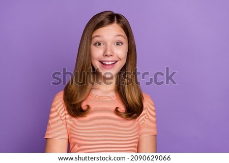 Portrait of attractive cheerful brown-haired girl laughing joke isolated over vibrant violet purple color background