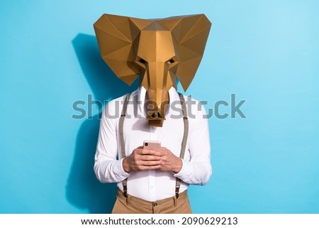 Photo of cool strange guy dressed wild animal mask typing modern device isolated blue color background Royalty-Free Stock Photo #2090629213