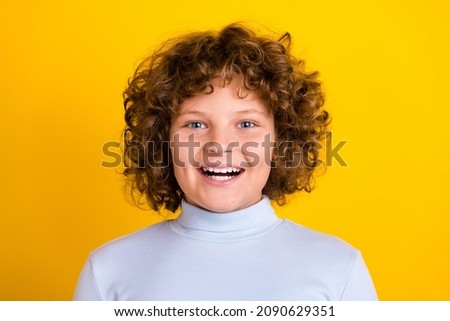 Photo of joyful little red hairdo boy laugh wear blue turtleneck isolated on yellow color background