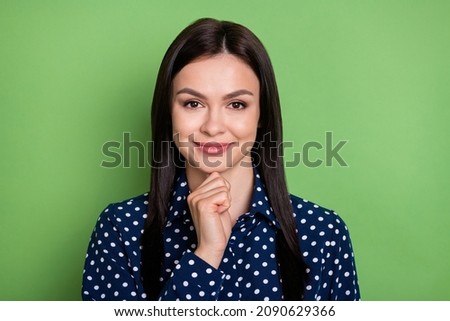 Photo of thinking straight hairdo young lady fist chin wear blue shirt isolated on green color background