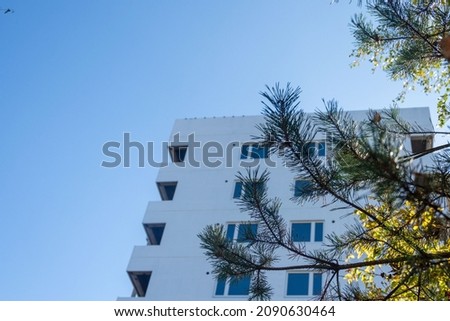 New residential multi-storey building against the blue sky